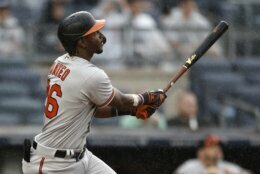 Baltimore Orioles' Jorge Mateo watches his run-scoring sacrifice fly against the New York Yankees during the fourth inning of a baseball game on Sunday, Sept. 5, 2021, in New York. (AP Photo/Adam Hunger)