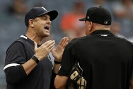 New York Yankees manager Aaron Boone, left, argues with home plate umpire Jeff Nelson after being ejected from a baseball game against the Baltimore Orioles during the fifth inning Sunday, Sept. 5, 2021, in New York. (AP Photo/Adam Hunger)