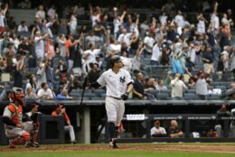 New York Yankees' Gary Sanchez watches his grand slam against the Baltimore Orioles during the second inning of a baseball game on Sunday, Sept. 5, 2021, in New York. (AP Photo/Adam Hunger)