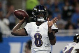 Baltimore Ravens quarterback Lamar Jackson (8) throws against the Detroit Lions in the first half of an NFL football game in Detroit, Sunday, Sept. 26, 2021. (AP Photo/Tony Ding)