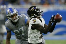 Baltimore Ravens wide receiver Marquise Brown (5) can't catch a pass as Detroit Lions defensive back Bobby Price (27) defends in the first half of an NFL football game in Detroit, Sunday, Sept. 26, 2021. (AP Photo/Duane Burleson)