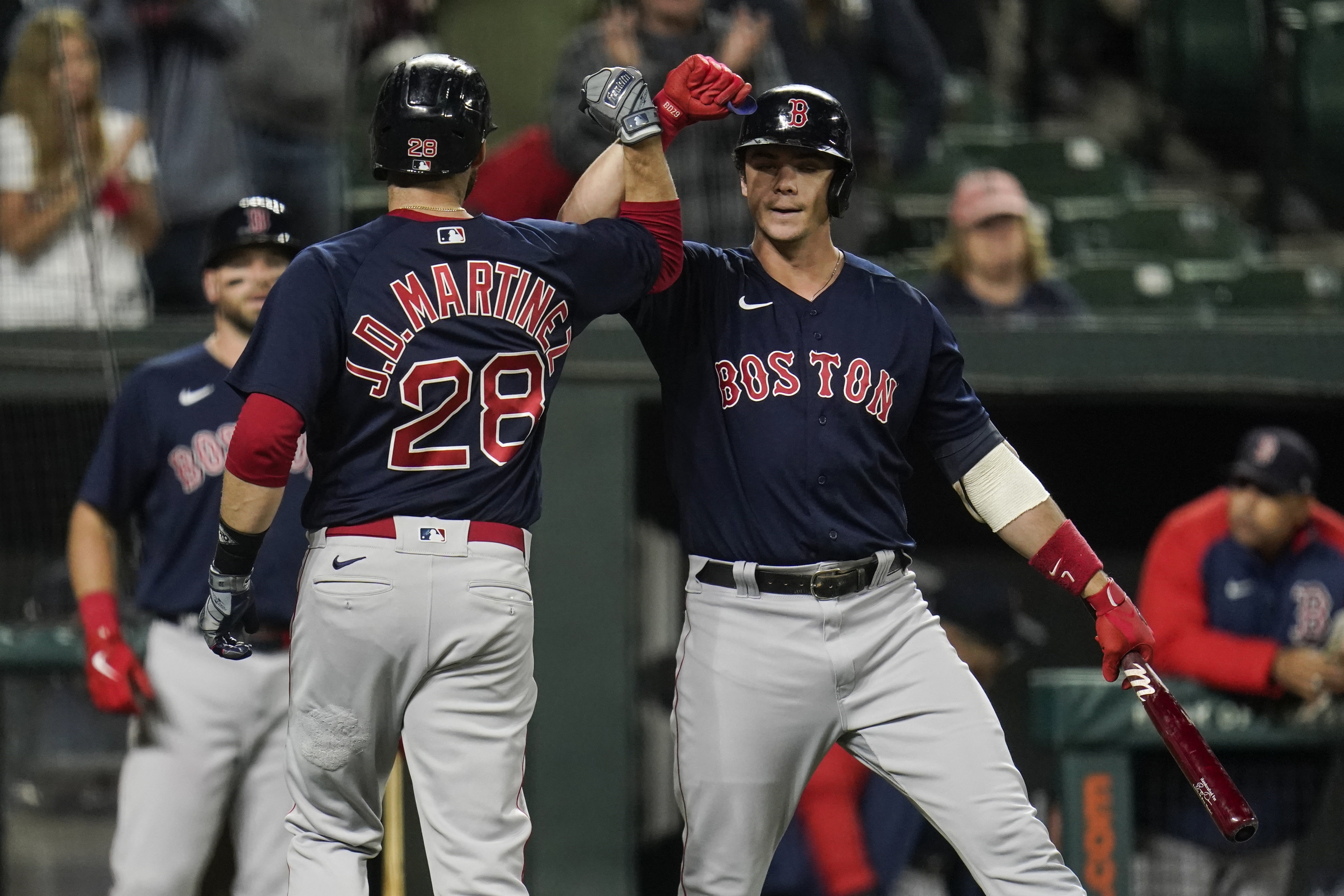 Boston Red Sox designated hitter J.D. Martinez watches his ball as