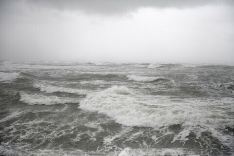 Tropical Storm Odette slogs offshore of mid-Atlantic coast