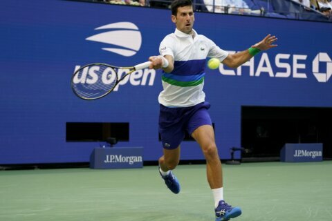The Latest: Sakkari beats 2019 champ Andreescu at US Open