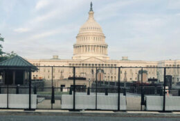 Concrete barriers and fencing in front of the U.S. Capitol.