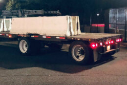 Concrete barriers on the bed of a truck before being offloaded at the U.S. Capitol. (WTOP/Nick Iannelli)
