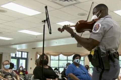 Violinist finds new way to connect with people by becoming a cop