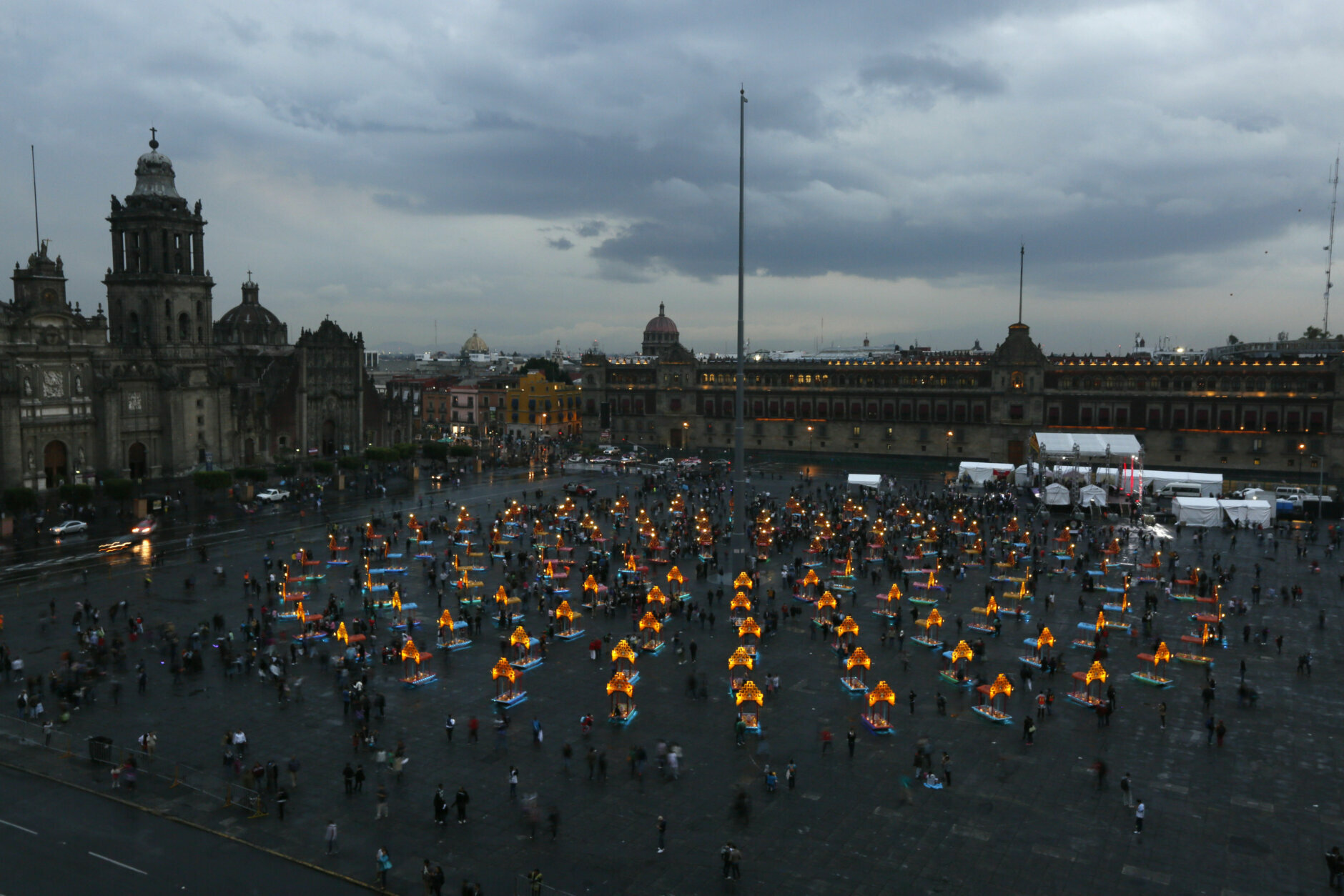 Representations of boats known as "trajineras" are on display in Mexico City's main square, the Zocalo, as part of the Day of the Dead festivities in Mexico City, Monday, Oct. 31, 2016. The holiday honors the dead as friends and families gather in cemeteries to decorate their loved ones' graves and hold vigil through the night on Nov. 1 and 2. (AP Photo/Moises Castillo)