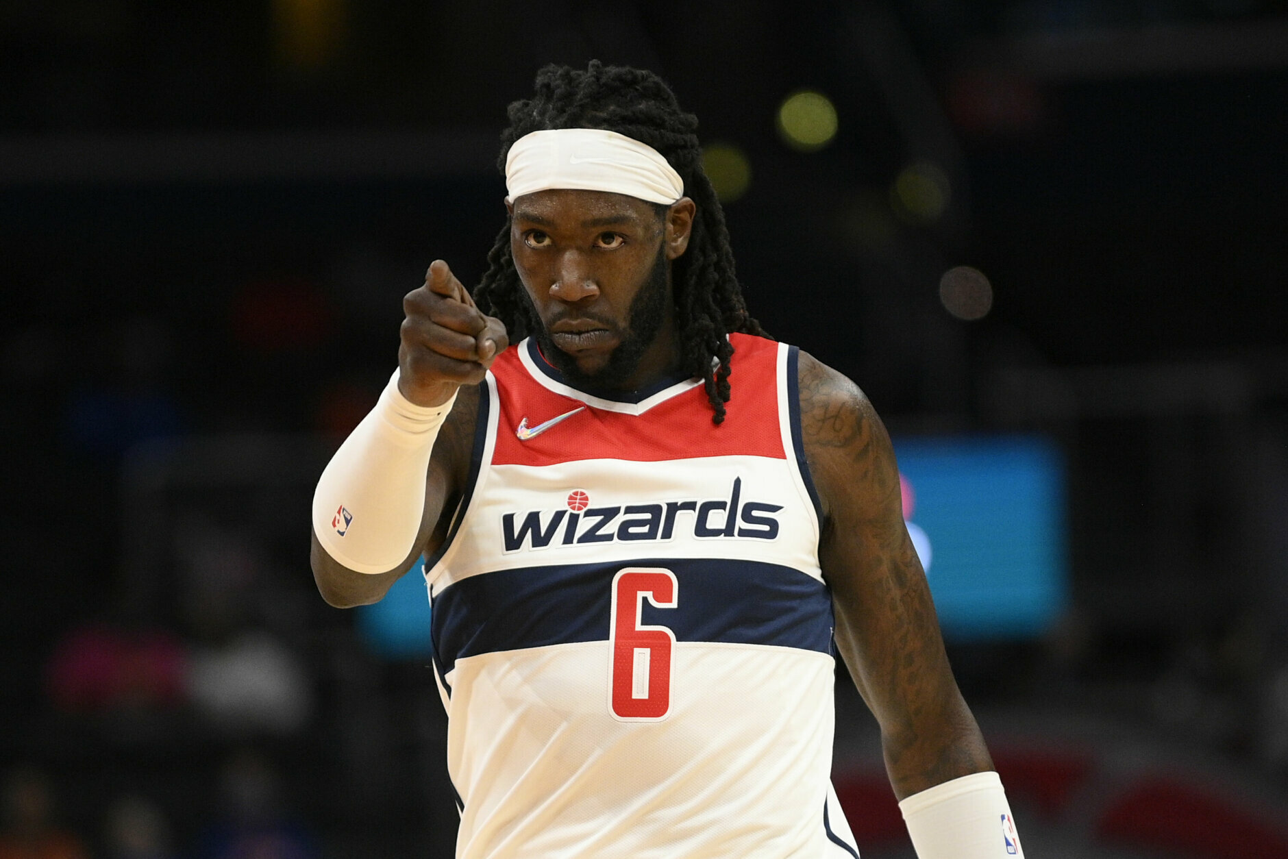 Washington Wizards center Montrezl Harrell points during the first half of an NBA preseason basketball game against the New York Knicks, Saturday, Oct. 9, 2021, in Washington. (AP Photo/Nick Wass)
