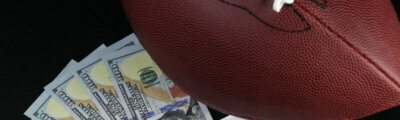 Image of a football with dollars.