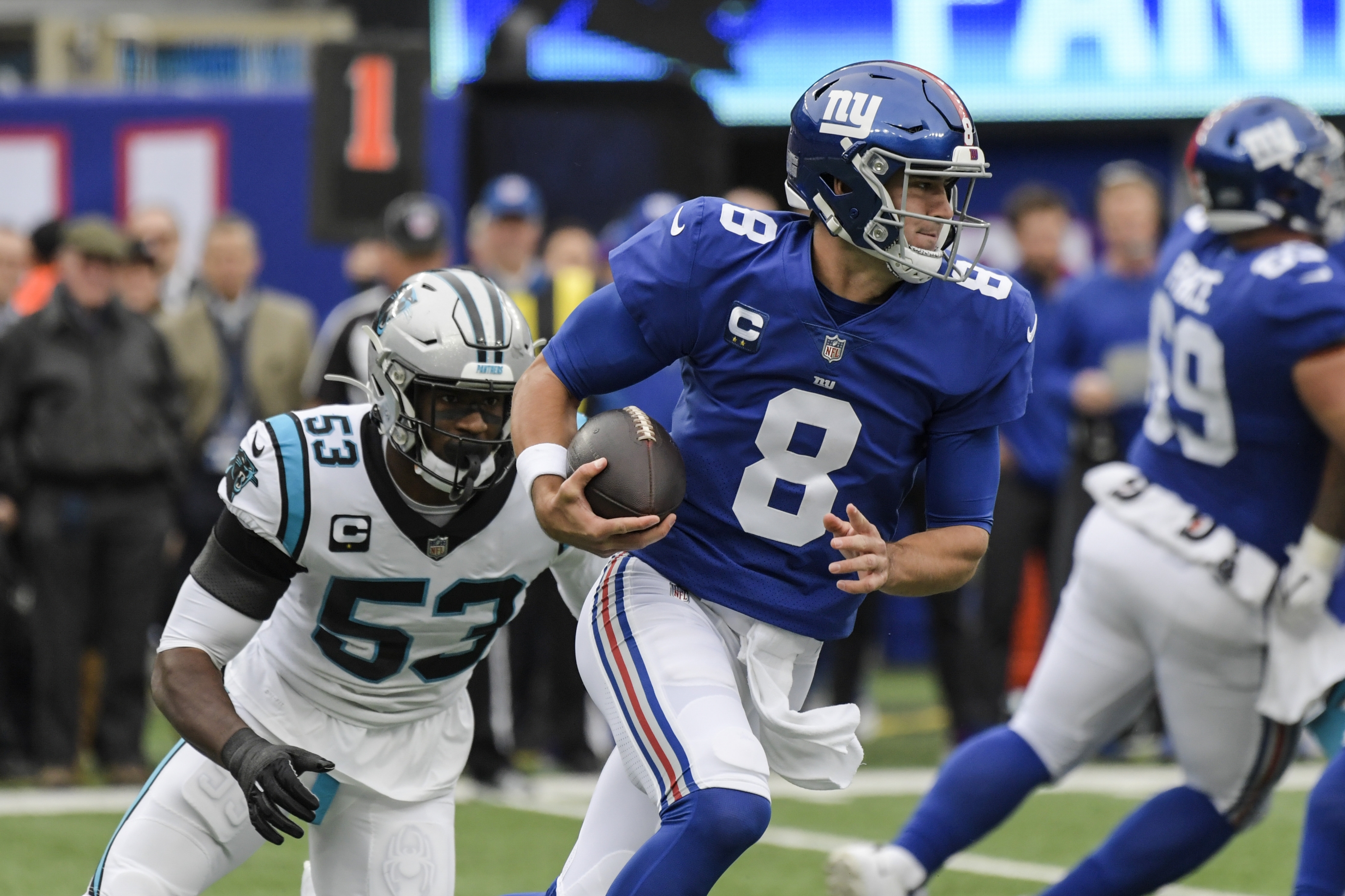 Jones passing and catching, Giants D spark win over Panthers