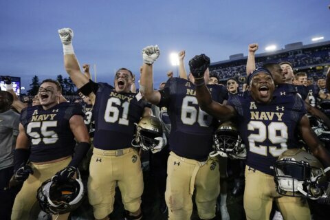 Navy scores 17 fourth-quarter points to overtake UCF 34-30