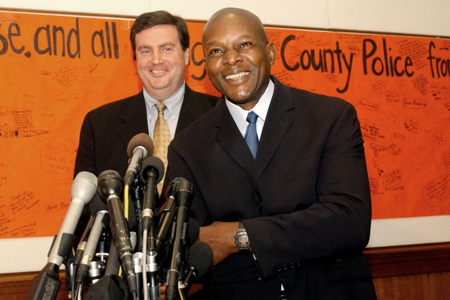 ROCKVILLE, MD - JULY 10:  Former Montgomery County Police Chief Charles Moose (R) speaks at a news conference  with County Executive Douglas M. Duncan July 10, 2003 in Rockville, Maryland.  Moose was at the forefront of the Washington, D.C. sniper case in October 2002 and recently stepped down from his duties after an ethics committee decided that his plans to write a book about the sniper case was a conflict of interest.  (Photo by Stephen J. Boitano/Getty Images)