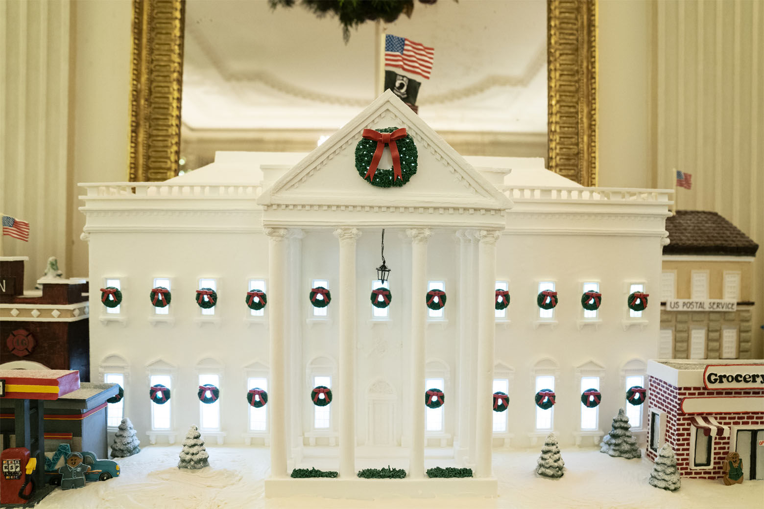 A White House gingerbread house sits in the State Dining Room during a press preview of the White House holiday decorations, Monday, Nov. 29, 2021, in Washington. (AP Photo/Evan Vucci)