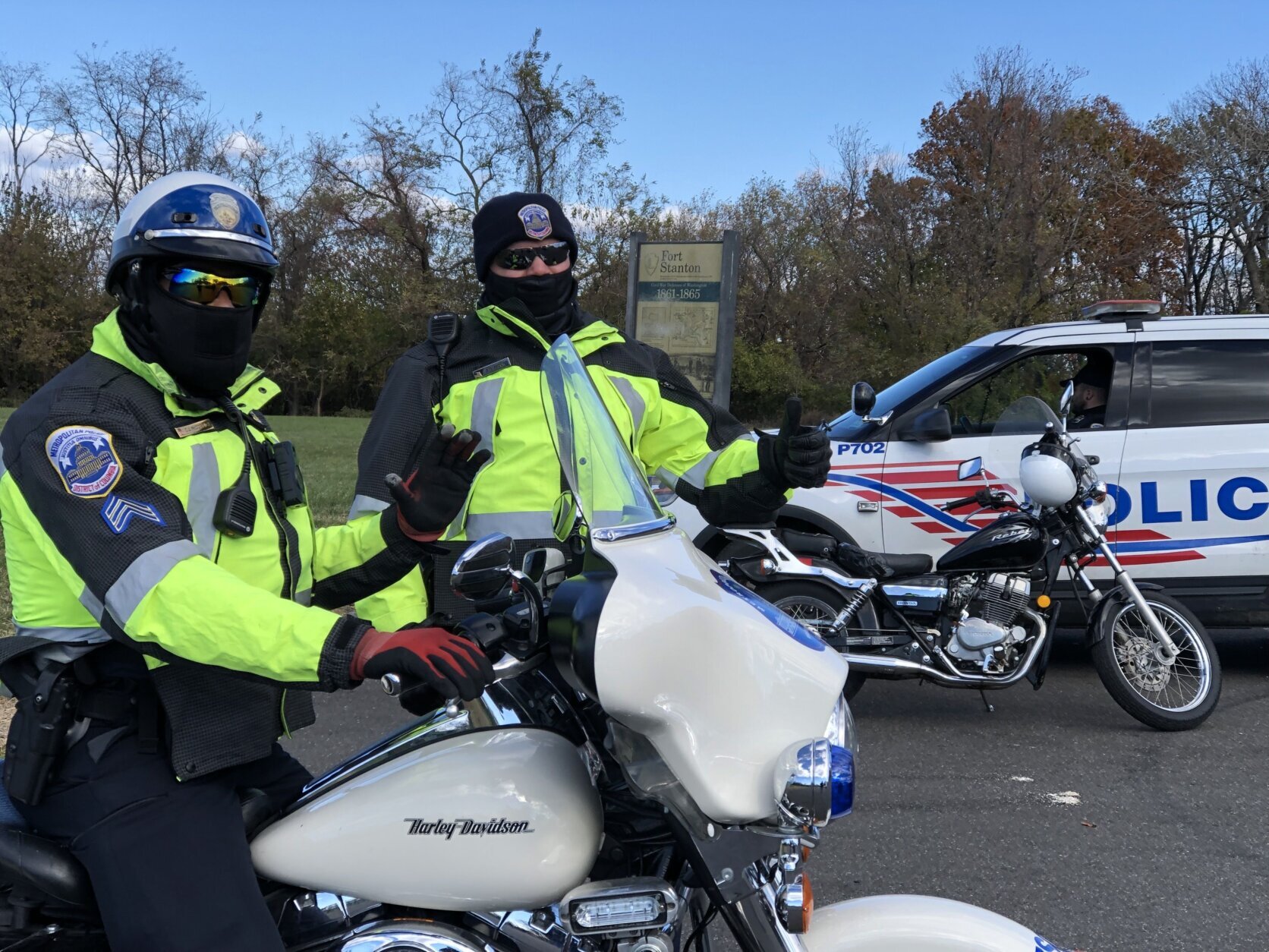 <p>D.C. police were also on hand to help with the coat-distribution event outside Our Lady of Perpetual Help Church on Friday. (WTOP/Kate Ryan)</p>

