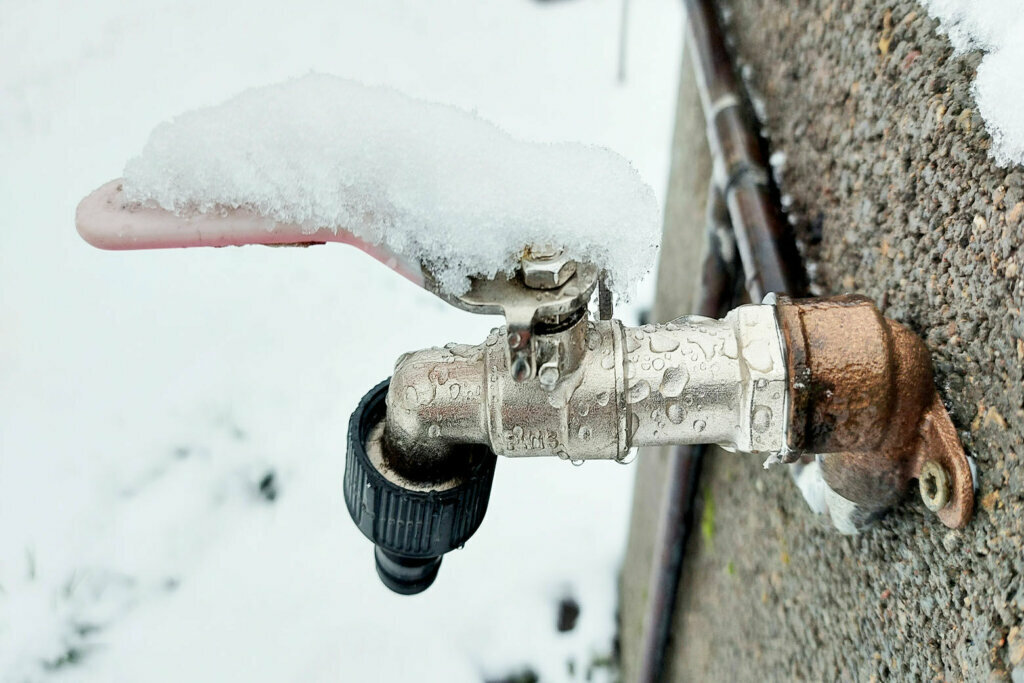 Faucet covered by snow
