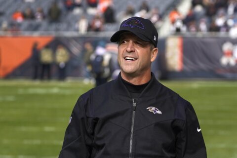 Ravens sign Harbaugh to 3-year extension through 2025