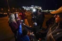 Melaine Coburn, left, and Megan Imbert, former employees of the Washington Football Team, speaking to members of the media in the parking lot of FedEx Field before the start of an NFL football game, Monday, Nov. 29, 2021, in Landover, Md. Coburn and Imbert are calling for NFL Commissioner and NFL to release a written report of the findings of the independent investigation into sexual harassment and abuse by the Washington Football Team. (AP Photo/Julio Cortez)