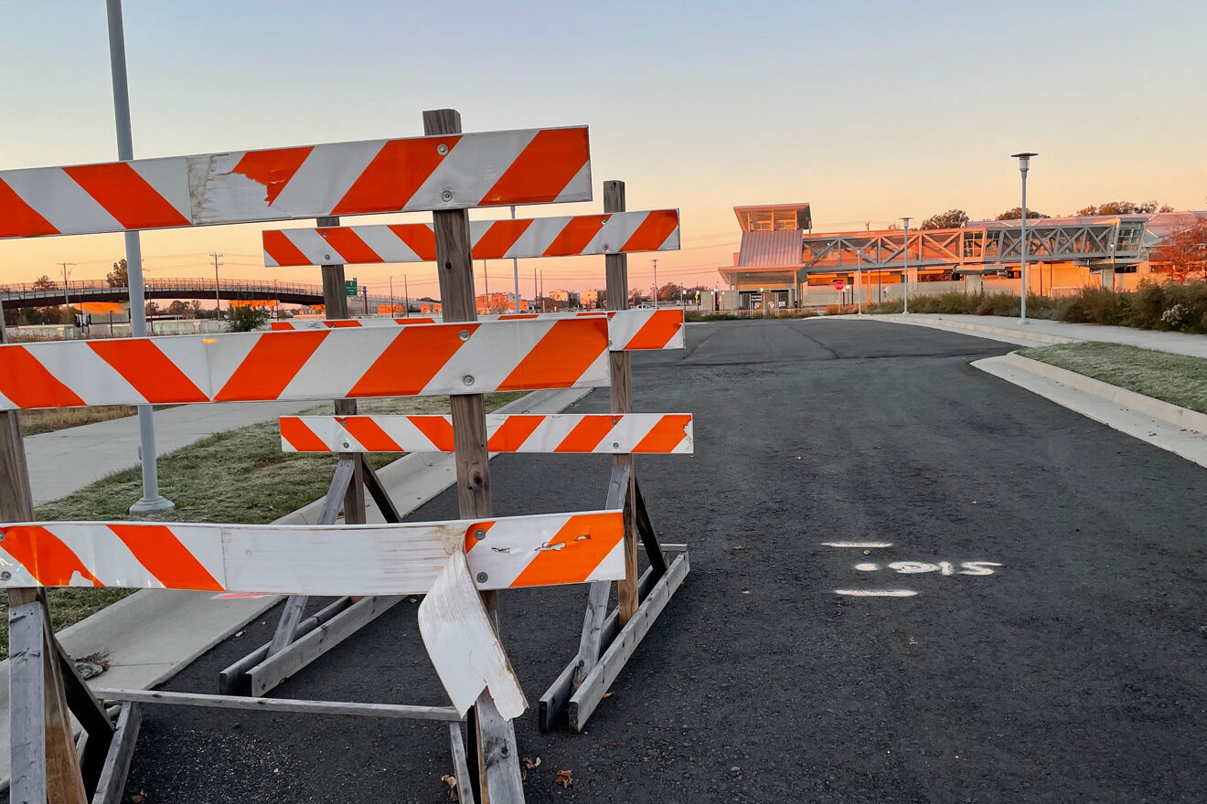 A row of orange and white road barriers.
