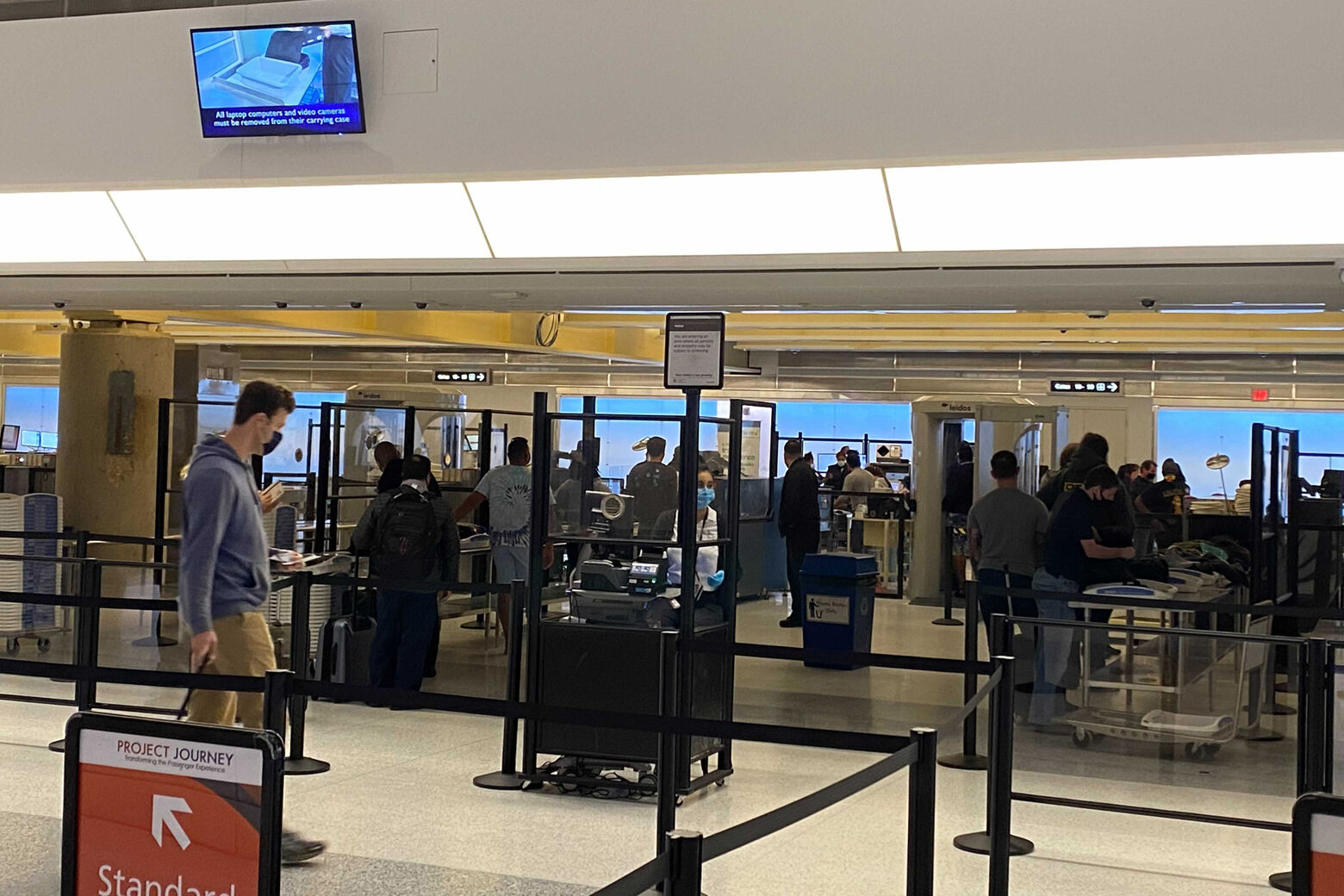 At Reagan National Airport, if you’re dropped off on the top level, you will go down a set of new escalators to the new security checkpoints. (WTOP/John Domen)