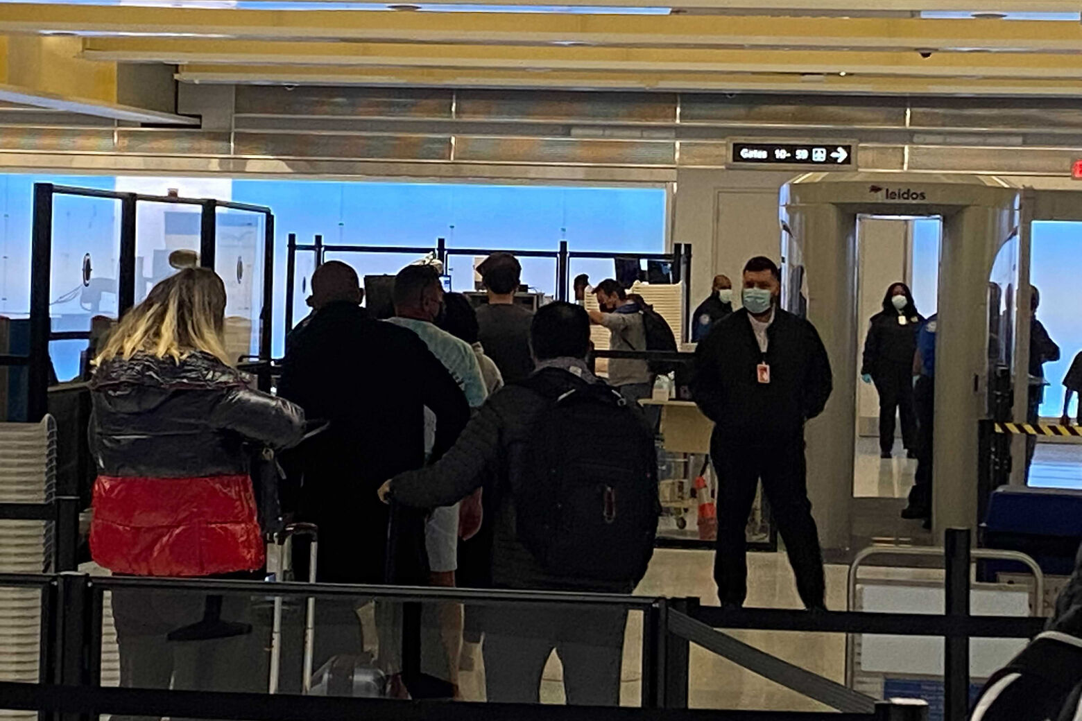 People wait in line at security at Reagan National Airport on Nov. 9, 2021. (WTOP/John Domen)