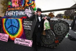 Activists blocked a number of roads during the morning rush Tuesday in an effort to pressure Congress on climate, health care, immigration and voting rights reforms. (WTOP/Alejandro Alvarez)