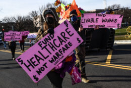 <p>Activists blocked a number of roads during Tuesday morning&#8217;s rush hour in an effort to pressure Congress on climate, health care, immigration and voting rights reforms. (WTOP/Alejandro Alvarez)</p>
