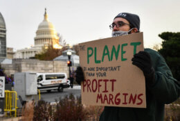 Activists blocked a number of roads during the morning rush Tuesday in an effort to pressure Congress on climate, health care, immigration and voting rights reforms. (WTOP/Alejandro Alvarez)