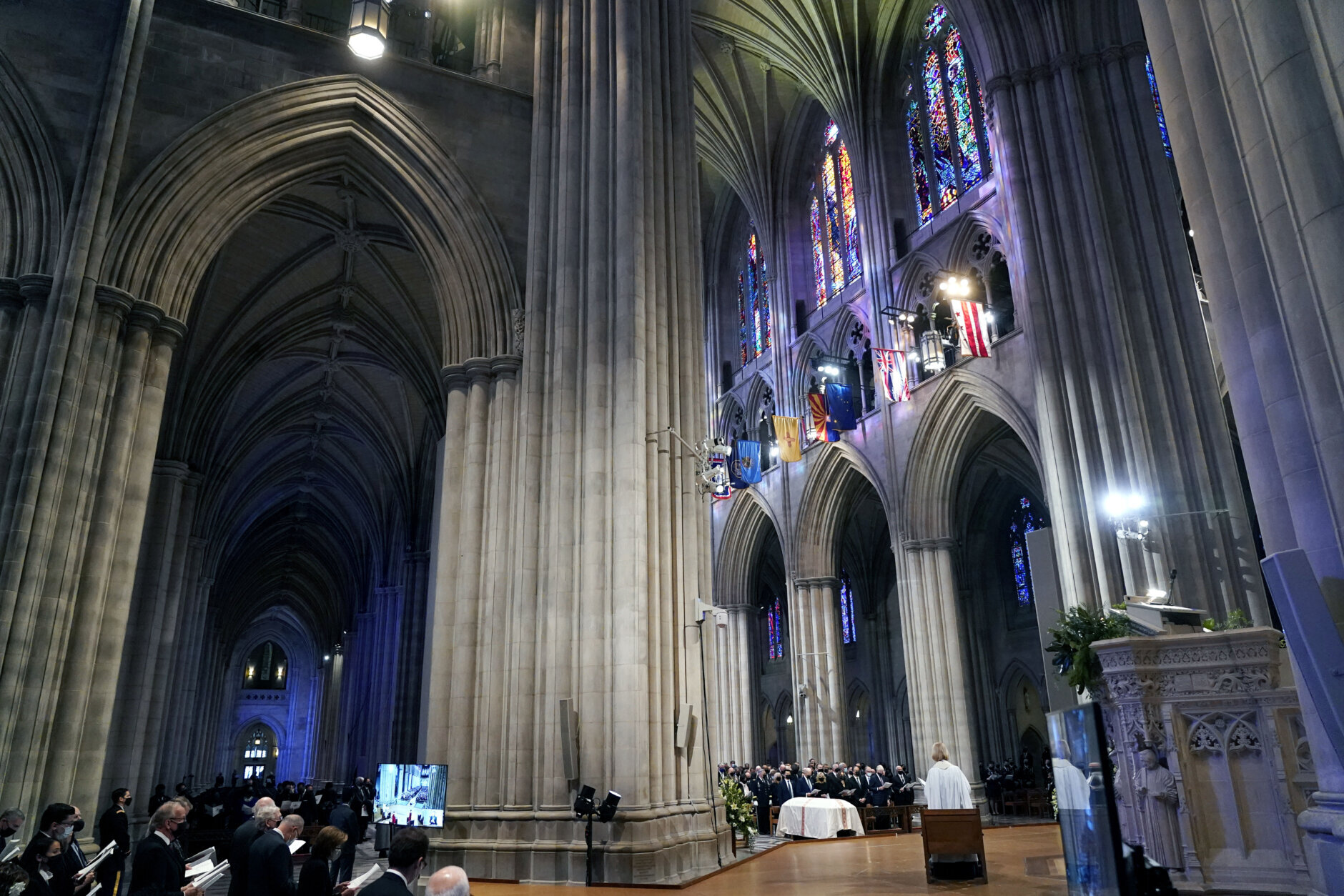 People attend the funeral service of former Sen. Bob Dole of Kansas, at the Washington National Cathedral, Friday, Dec. 10, 2021, in Washington. (AP Photo/Jacquelyn Martin)