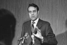 Sen. Robert Dole, R-Kan., discussed Senate security at a news conference March 9, 1971 in St. Louis, after an explosion in the U.S. Capitol. Dole said senators are vulnerable to anyone who might throw a bomb or even "a Wilkie button" from the open gallery. (AP Photo/Fred  Waters)
