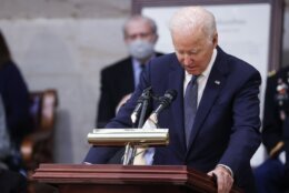 President Joe Biden speaks near the casket of former Sen. Bob Dole, who died on Sunday, during a congressional ceremony to honor Dole, who lies in state in the U.S. Capitol Rotunda in Washington, Thursday, Dec. 9, 2021. (Jonathan Ernst/Pool via AP)