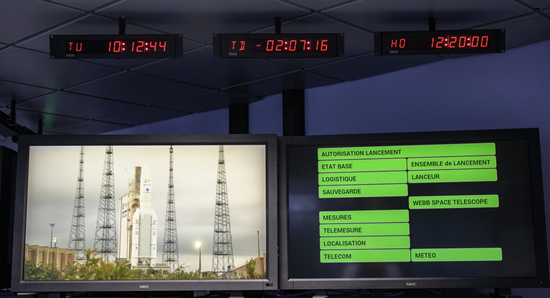 Monitors show the current status ahead of the launch of Arianespace's Ariane 5 rocket carrying NASA's James Webb Space Telescope, Saturday, Dec. 25, 2021, in the Jupiter Center at the Guiana Space Center in Kourou, French Guiana.  The world's largest and most powerful space telescope has blasted off on a high-stakes quest to behold light from the first stars and galaxies. NASA's James Webb Space Telescope rocketed away Saturday from French Guiana in South America.  (NASA/Bill Ingalls/NASA via AP)