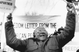 <p>South African Bishop Desmond Tutu waves during a 1986 speech against apartheid outside the South African Embassy in Washington. An uncompromising foe of apartheid, South Africa’s brutal regime of oppression again the Black majority, Tutu worked tirelessly and peacefully against it.</p>
