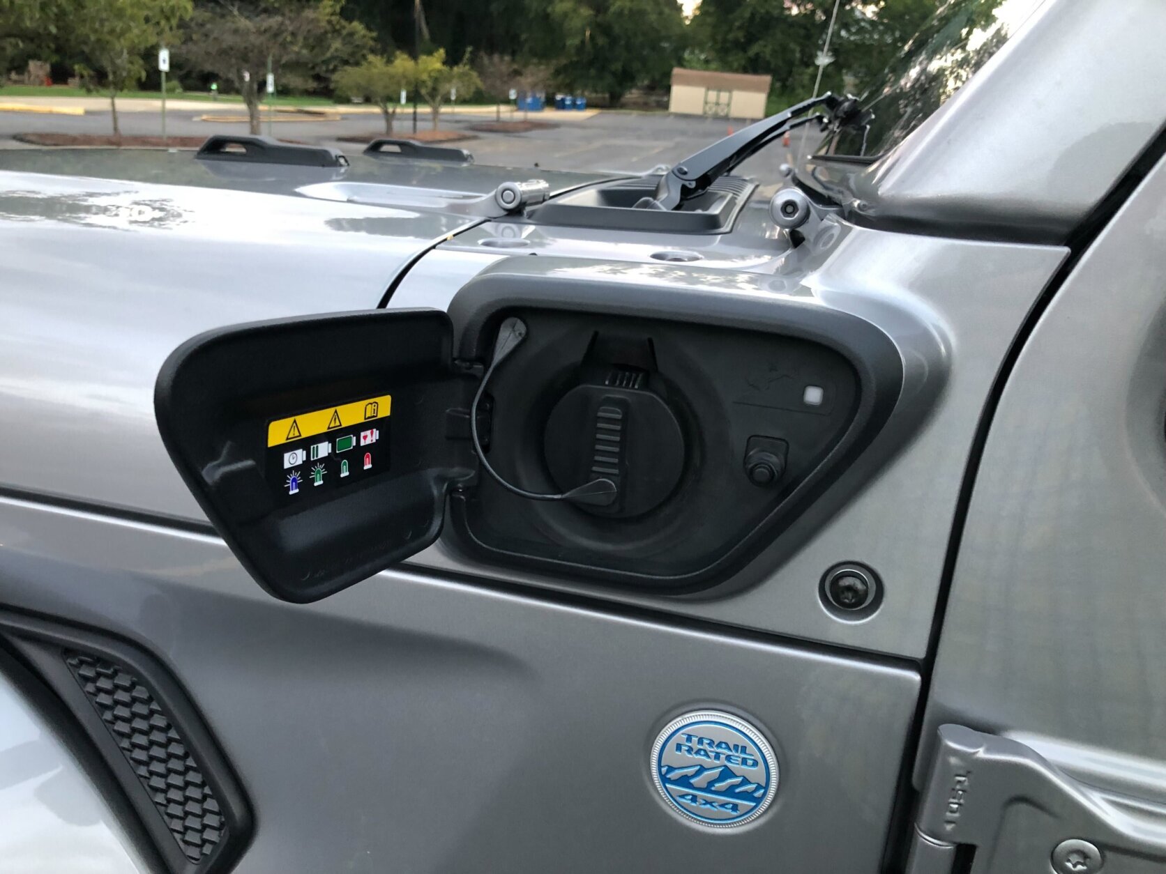 <p>The Wrangler unlimited 4XE has a charging port in front of the drivers door (WTOP/Mike Parris).</p>
