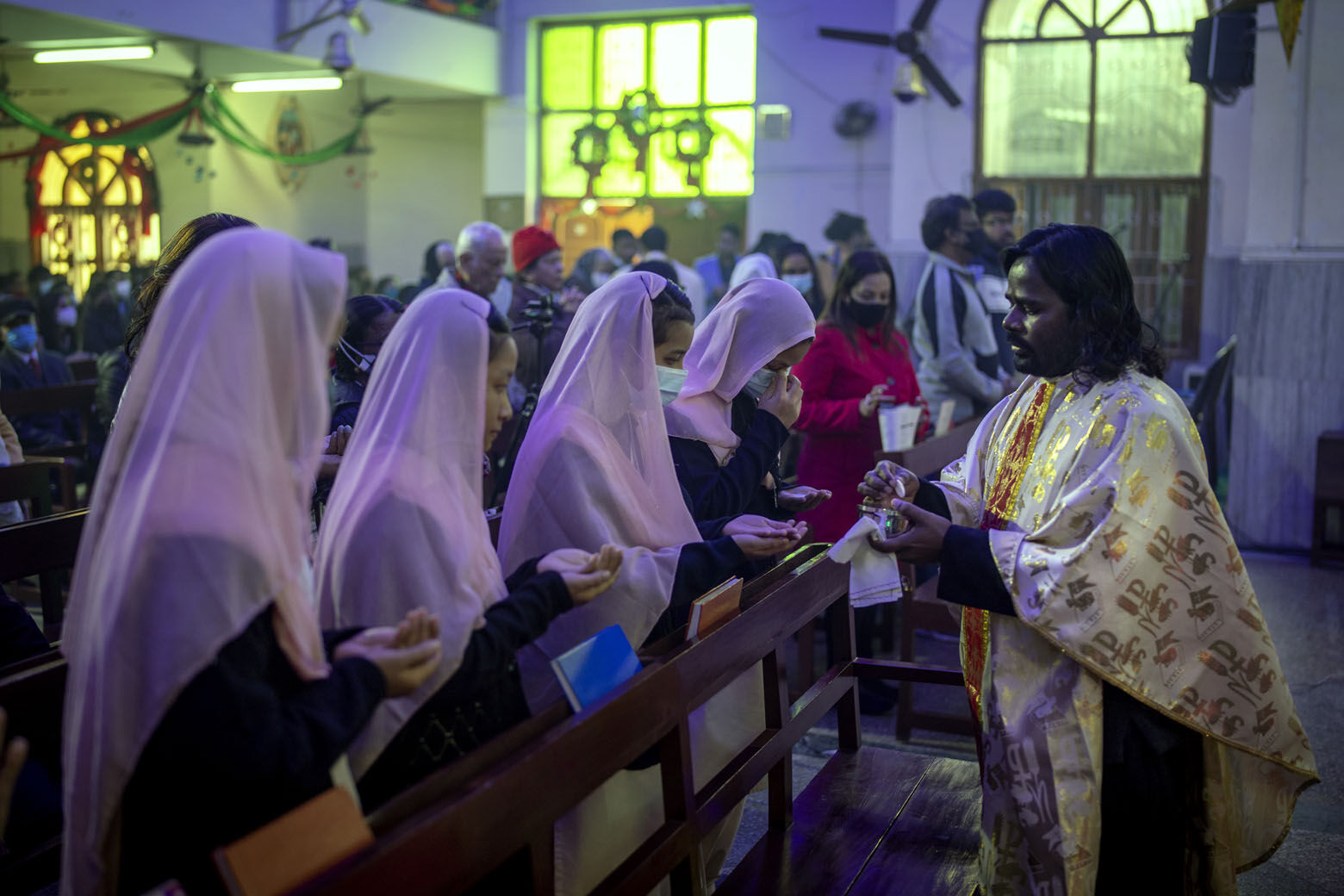 Indian Christians receive the holy communion