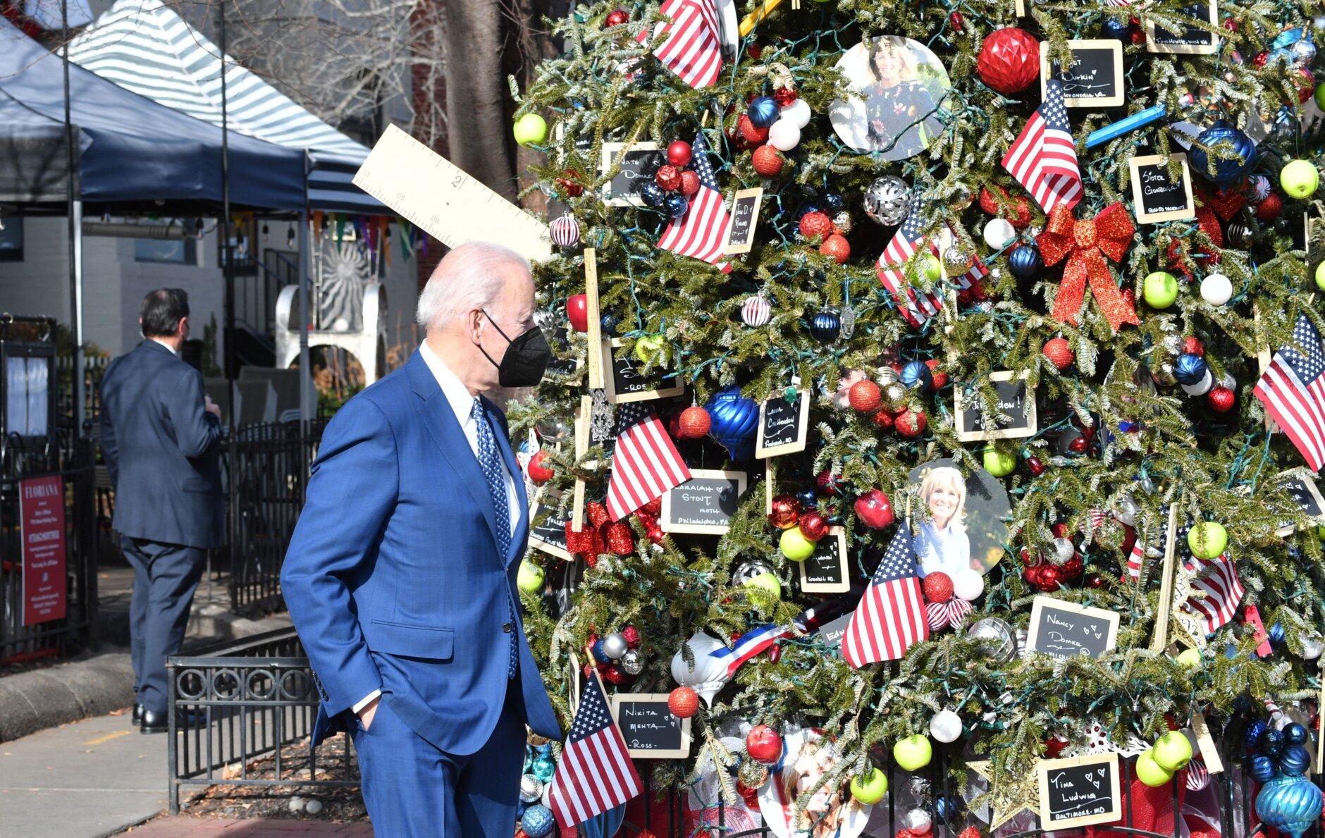 US President Joe Biden visits the Christmas Tree in honor of First Lady Jill Biden outside Floriana Italian Restaurant in Washington, DC, on December 24, 2021. (Photo by Nicholas Kamm / AFP) (Photo by NICHOLAS KAMM/AFP via Getty Images)