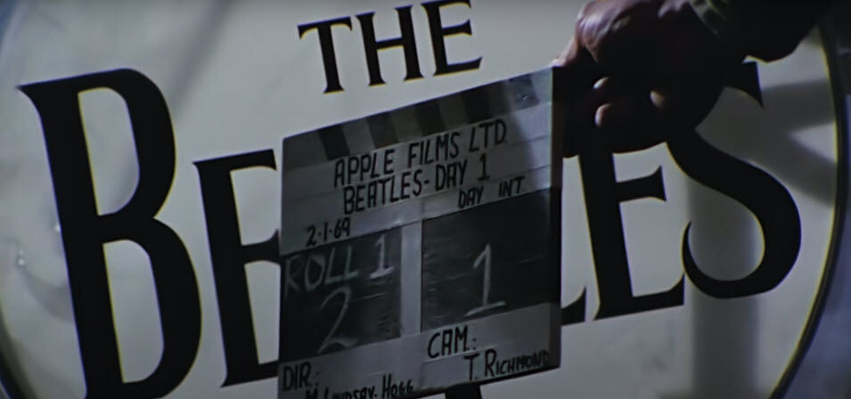 <p>&#8220;In Episode One, in the very first couple of seconds, you see Mal Evans, their equipment manager, holding a drumhead with the Beatles logo on front. Actually, the beginning of the &#8216;Let It Be&#8217; film is exactly the same thing,&#8221; Lease said. &#8220;It was painted specifically for that, but was never used.&#8221;</p>
<p>In 1969, drummers — including Ringo — were seeking to get a deadened, thumping sound from their bass drums. To do that, drummers would stuff blankets and other sound-absorbing materials into a bass drum, and do without a front drum head.</p>
<p>&#8220;So, that logo drumhead never went on the front of the drum, and you never see it again,&#8221; Lease said. However, since it made a brief appearance in &#8220;Let It Be,&#8221; and eventually &#8220;Get Back,&#8221; Lease said it is considered the <a href="https://www.beatlesuits.com/saga-of-seven-skins-story.html" target="_blank" rel="noopener">seventh and final authentic drumhead</a> emblazoned with the famous &#8220;drop-T&#8221; Beatle logo.</p>
<p>Lease said John Lennon gave the drumhead to an Apple employee, who eventually sold it at auction to an anonymous purchaser. &#8220;So, I guess it&#8217;s hanging over somebody&#8217;s fireplace somewhere.&#8221;</p>
