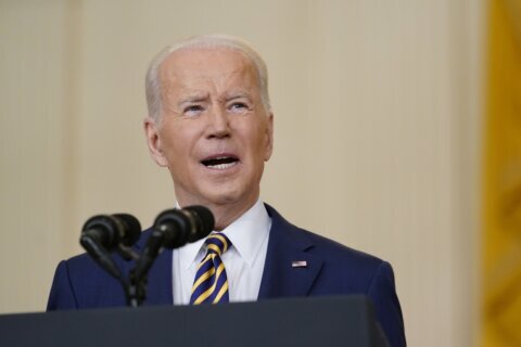 Biden says nation weary from COVID but rising with him in WH