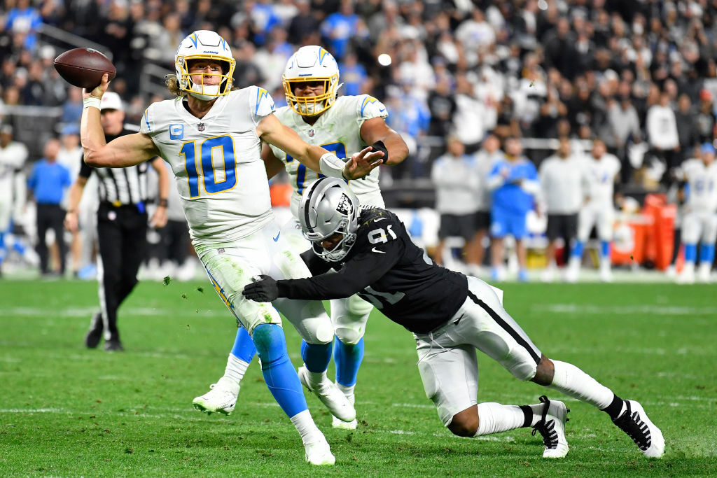 <p><em><strong>Chargers 32</strong></em><br />
<em><strong>Raiders 35 (OT)</strong></em></p>
<p>This was so much better than <a href="https://www.sbnation.com/nfl/2022/1/3/22865100/raiders-chargers-week-18-meaningless-playoff-picture-afc-colts" target="_blank" rel="noopener">the kneel-down scenario</a>.</p>
<p>Daniel Carlson drinks for free in Las Vegas! But so should Rich Bisaccia; the Raiders interim coach, in his 38th NFL season, is believed to be only <a href="https://www.reviewjournal.com/sports/raiders/the-long-strange-history-of-nfl-interim-coaches-2461040/" target="_blank" rel="noopener">the third interim NFL coach since 1960</a> to lead a team to the playoffs — and considering he&#8217;s going up against a Bengals team that hasn&#8217;t won a playoff game in over three decades, he might actually mess around and win a game or two. I know Vegas is known for star power but that shouldn&#8217;t <a href="https://profootballtalk.nbcsports.com/2022/01/09/could-raiders-try-to-trade-for-a-rock-star-coach-like-mike-tomlin-or-sean-payton/" target="_blank" rel="noopener">apply to this coaching search</a>, even if Bisaccia&#8217;s team goes one-and-done in the postseason.</p>
<p>And let&#8217;s give Justin Herbert his due for one of the most unbelievable late game performances I’ve ever seen. A QB <a href="https://twitter.com/rodger/status/1480433569059254274?s=21" target="_blank" rel="noopener">making fourth-and-long look routine</a> is just what a franchise notoriously snake-bitten in late-game scenarios needs — and it’s probably going to spark another round of debates here in Washington.</p>
<blockquote class="twitter-tweet" data-width="500" data-dnt="true">
<p lang="en" dir="ltr">Also this comeback is gonna touch off another round of &quot;Should WFT have drafted Justin Herbert instead of Chase Young&quot; debates</p>
<p>&mdash; Rob Woodfork (@RobWoodfork) <a href="https://twitter.com/RobWoodfork/status/1480401467966205953?ref_src=twsrc%5Etfw">January 10, 2022</a></p></blockquote>
<p><script async src="https://platform.twitter.com/widgets.js" charset="utf-8"></script></p>
