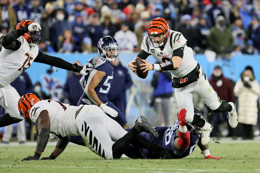 <p><em><strong>Bengals 19</strong></em><br />
<em><strong>Titans 16</strong></em></p>
<p>Y&#8217;all laughed when <a href="https://profootballtalk.nbcsports.com/2022/01/18/joe-burrow-this-is-how-its-going-to-be-from-here-on-out/" target="_blank" rel="noopener">Joe Burrow said Cincinnati will be ballin&#8217; from here on out</a> (I know because I certainly did) but Joe Cool 2.0 overcame an NFL playoff record-tying nine (9!) sacks to send the Bengals to their first AFC title game since 1988. I believed in Burrow taking Cincy to new heights &#8212; but he&#8217;s a year or two sooner than reasonably expected.</p>
<p>At a time when <a href="https://www.tennessean.com/story/sports/nfl/titans/2022/01/12/did-tennessee-titans-quarterback-ryan-tannehill-recapture-his-mojo/9135853002/" target="_blank" rel="noopener">Ryan Tannehill was trying to recapture his mojo</a>, the only thing he brought back was the inconsistency that got him run out of Miami. Don&#8217;t be surprised if this is the year Tennessee drafts a QB to develop behind Tannehill &#8212; and maybe even makes a big swing for Aaron Rodgers or Russell Wilson.</p>
