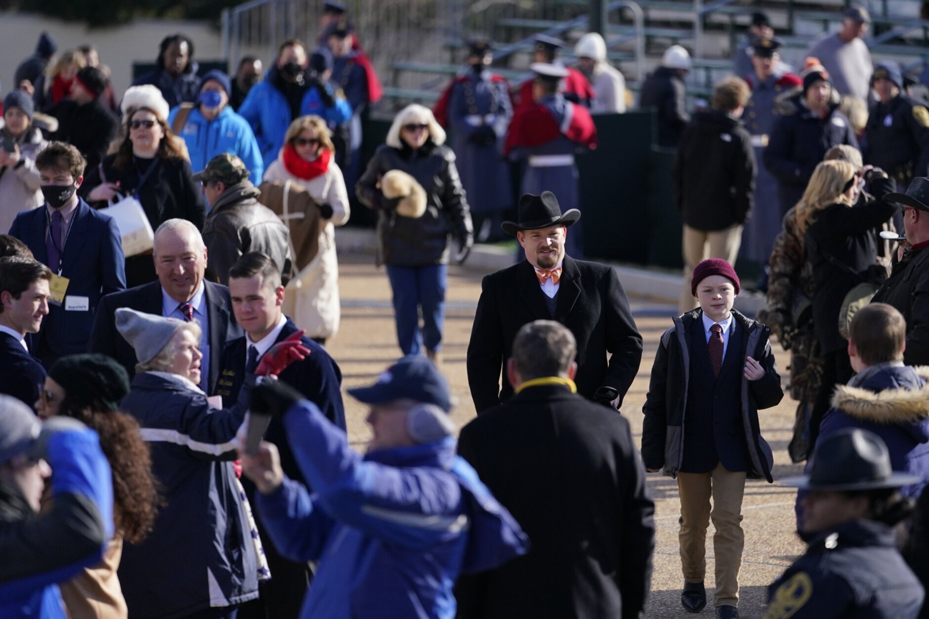 People arrive to the gallery ahead of the inauguration ceremony, Saturday, Jan. 15, 2022, in Richmond. Virginia Gov.-elect Glenn Youngkin will be sworn in today. (AP Photo/Julio Cortez)