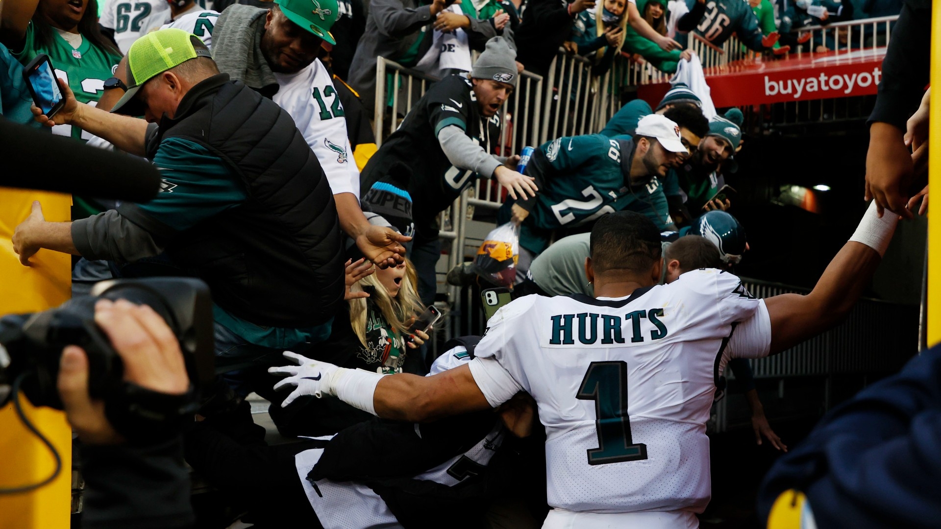 Eagles QB Jalen Hurts nearly sacked after railing collapses, fans fall at  FedEx Field