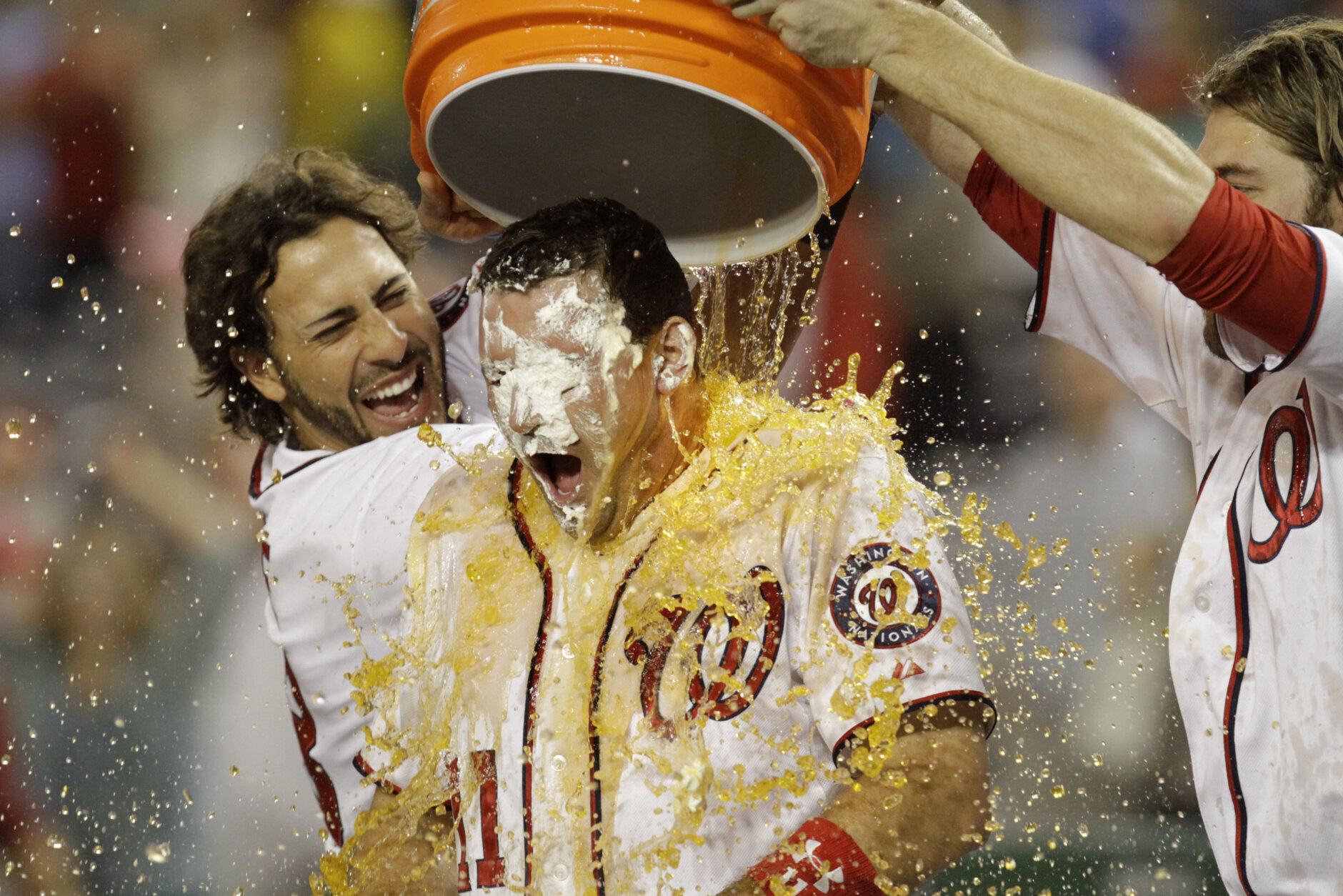 <p>Zimmerman had a knack for meeting the moment — no matter how big it was. The now two-time Silver Slugger had his fair share of walk-off homers, such as this game-sealing grand slam in an 8-4 win over Philadelphia Phillies in August 2011. Clearly former teammates Michael Morse, left, and Jayson Werth, right, were happy with him.</p>
