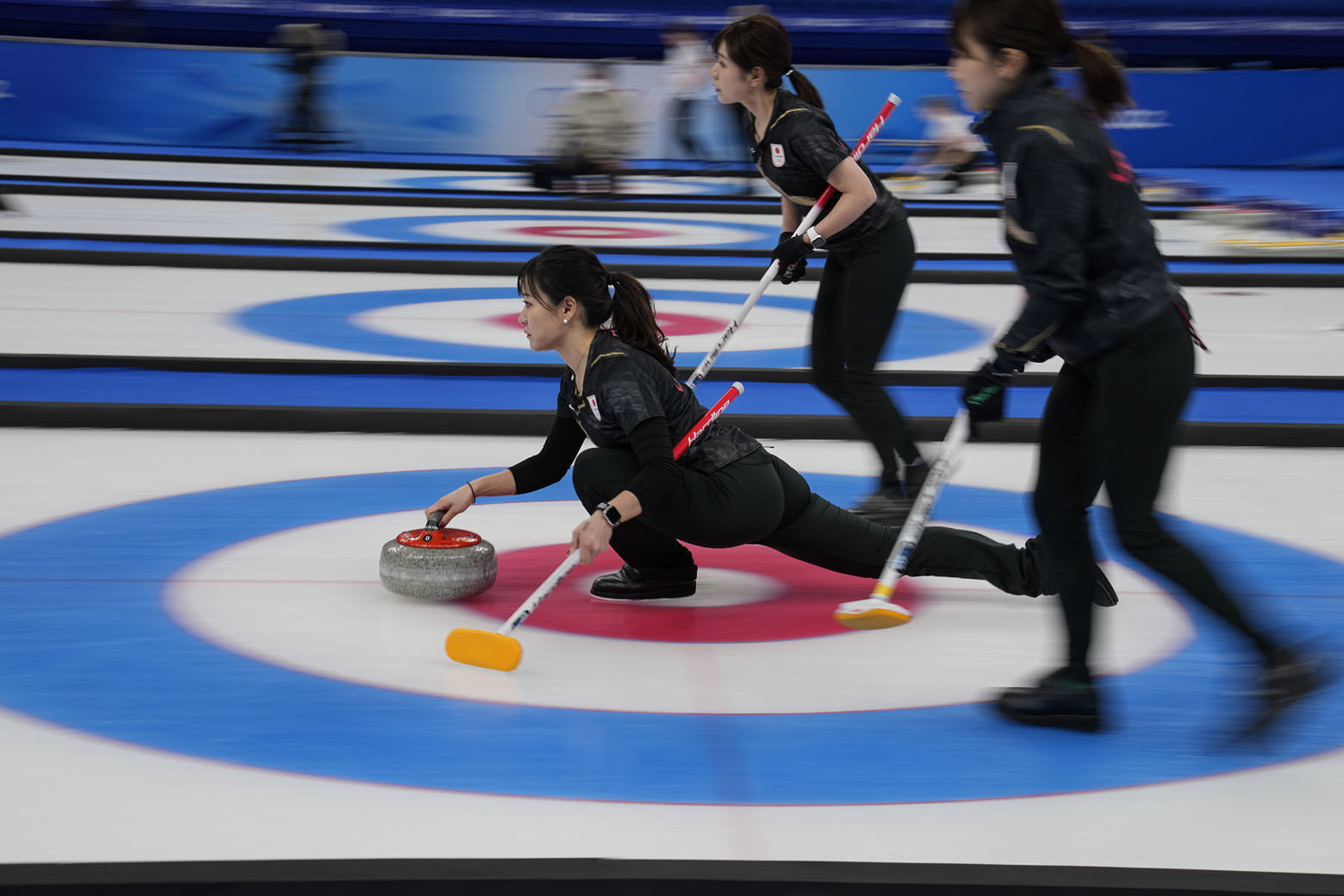 <p>Japan&#8217;s Chinami Yoshida throws a rock during a women&#8217;s curling match against Denmark at the Beijing Winter Olympics Saturday, Feb. 12, 2022, in Beijing.</p>
