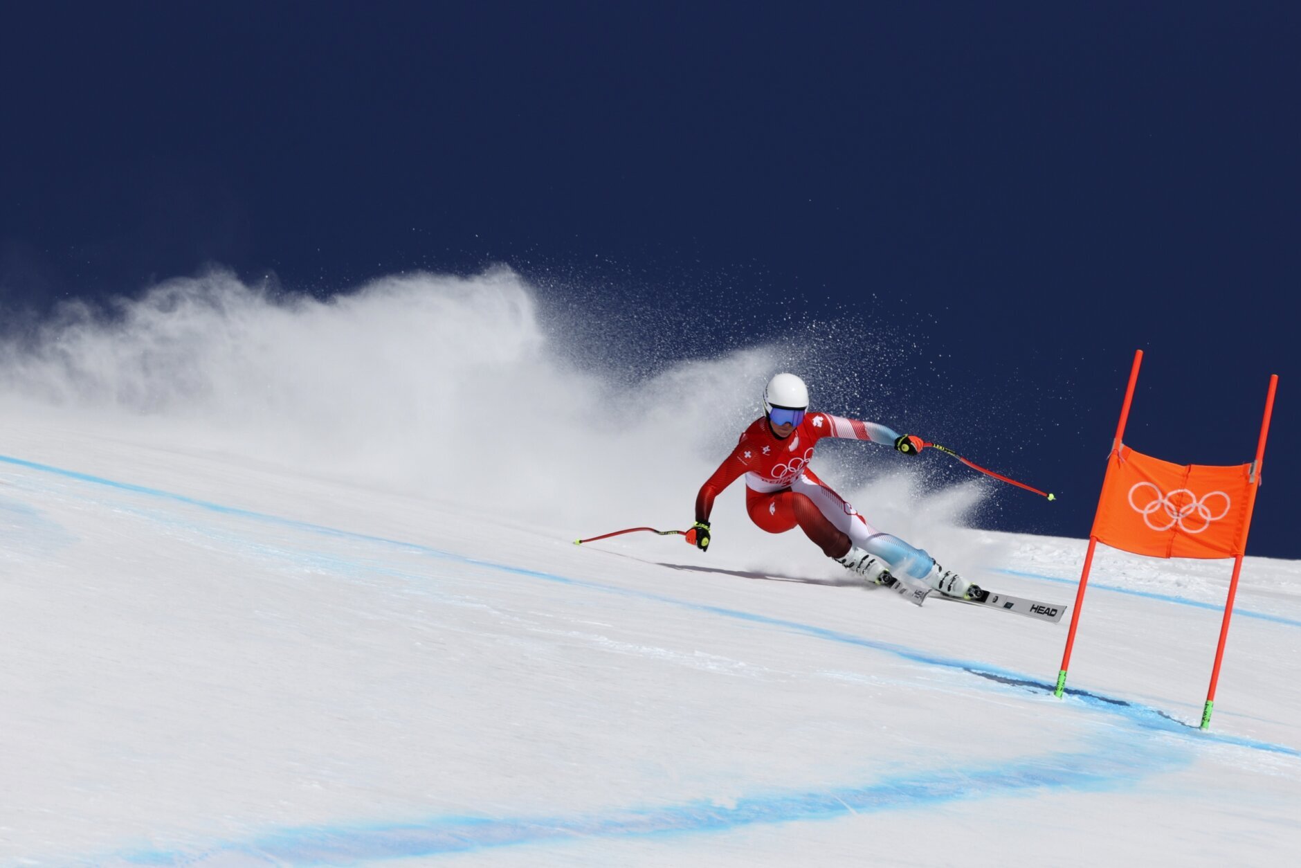 <p>Corinne Suter, of Switzerland makes a turn during the women&#8217;s downhill at the 2022 Winter Olympics, Tuesday, Feb. 15, 2022, in the Yanqing district of Beijing.</p>
