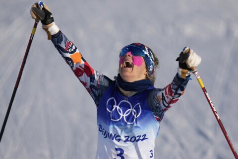 Johaug wins 1st gold medal of Beijing Olympics in skiathlon