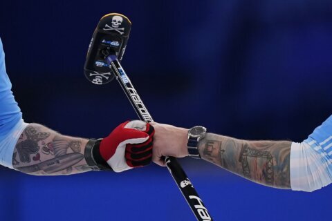GLIMPSES: A rare look at tattooed flesh on the Olympic ice