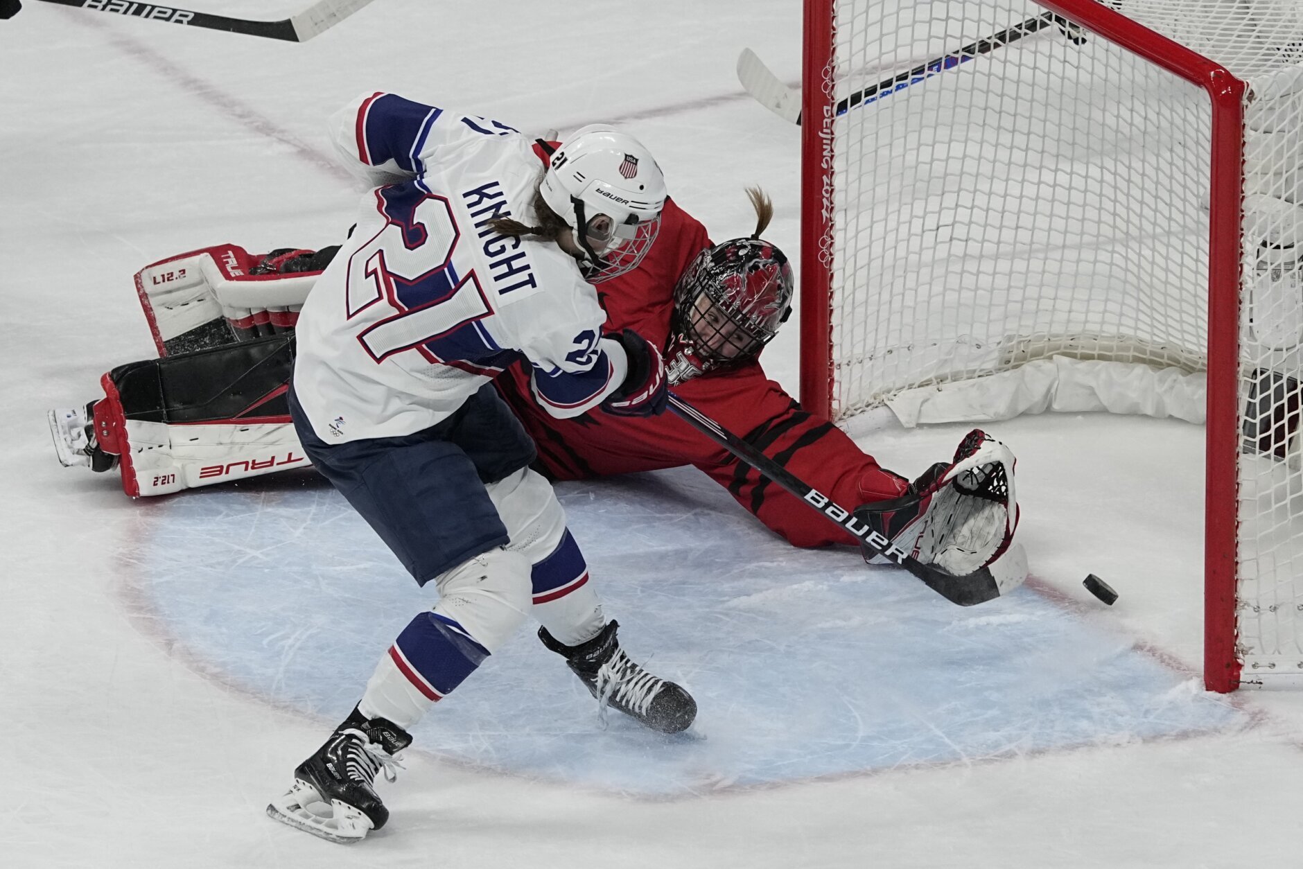 <p>United States&#8217; Hilary Knight (21) scores past Canada goalkeeper Ann-Renee Desbiens (35) during the women&#8217;s gold medal hockey game at the 2022 Winter Olympics, Thursday, Feb. 17, 2022, in Beijing.</p>
