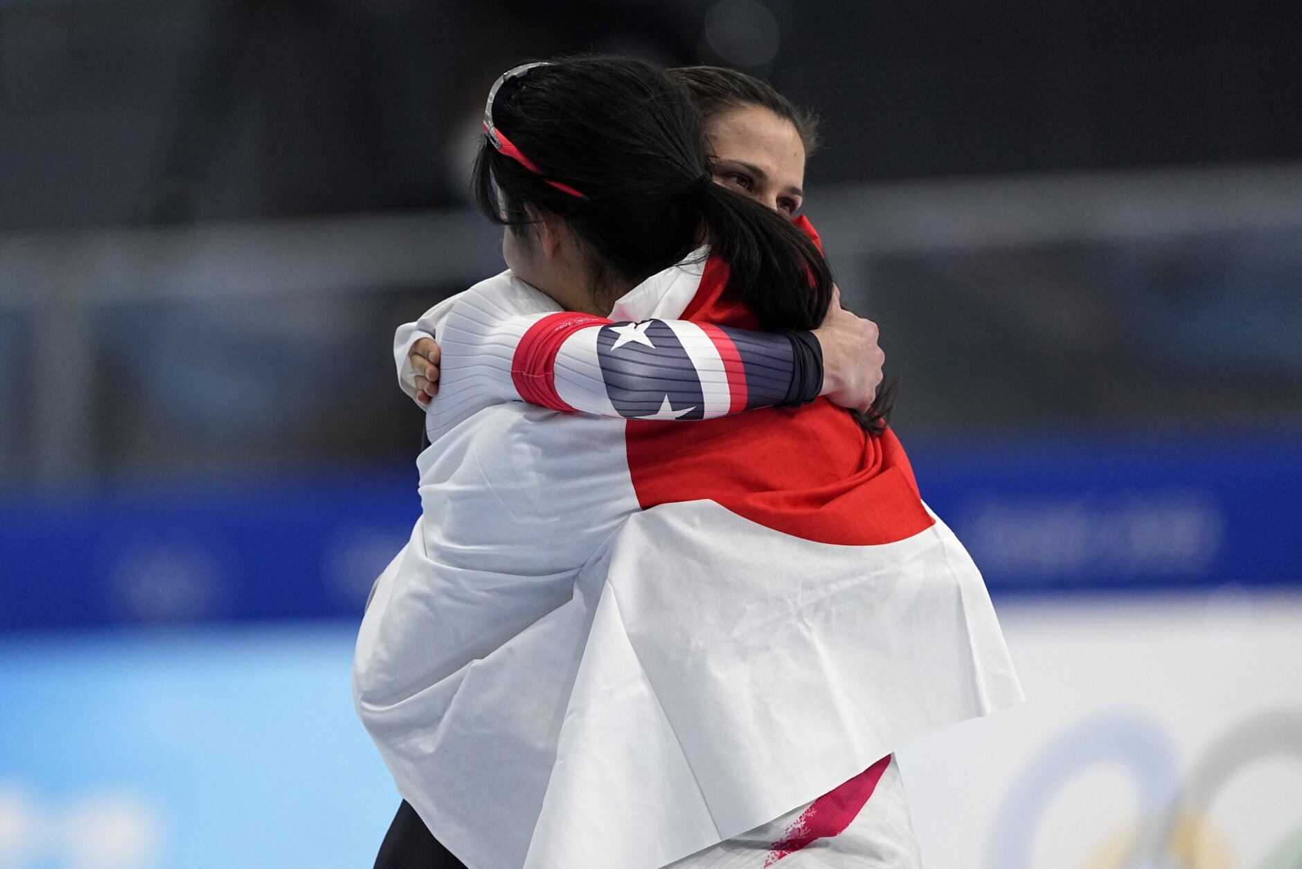 <p>Gold medal winner Miho Takagi of Japan hugs bronze medalist Brittany Bowe of the United States, facing right, after the women&#8217;s speedskating 1,000-meter finals at the 2022 Winter Olympics, Thursday, Feb. 17, 2022, in Beijing.</p>
