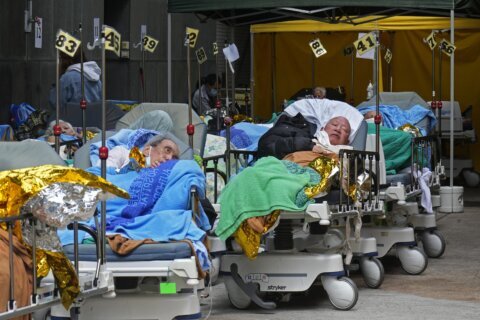 Hong Kong hospitals hit 90% capacity as COVID-19 cases surge